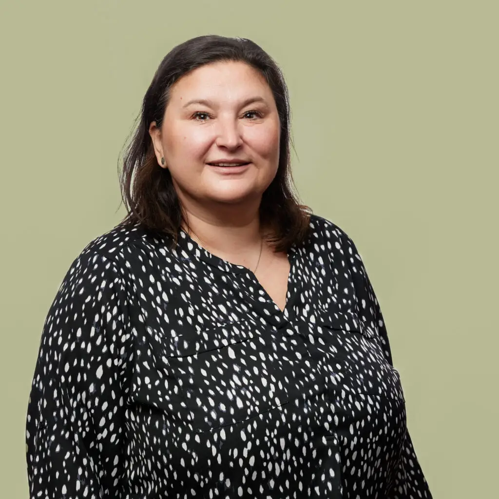 a woman in a black and white shirt